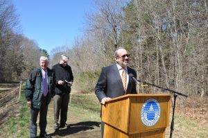 Natick Board of Selectmen Chair Joshua Ostroff (at podium) Aqueduct Trail opening, April 24, 2014, Natick, Mass. MAPC staff photo.