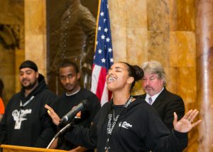 Carla Ribeiro, a peace advocate with Brockton's Safe Corners Initiative, opened the event with a powerful song celebrating harmony among young people. MAPC Metro Mayors Coalition Community Safety Day on the Hill, Boston, Mass., April 30, 2014. Courtesy Marilyn Humphries.