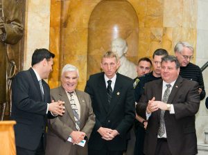 Mayor Gary Christenson of Malden, Representative Paul J. Donato (Third Division Chair), BPD Commissioner Evans, and Mayor Dan Rizzo of Revere share a word at the Community Safety Day on the Hill at the State House. Lew Finfer (back right). MAPC Metro Mayors Coalition Community Safety Day on the Hill, Boston, Mass., April 30, 2014. Courtesy Marilyn Humphries.