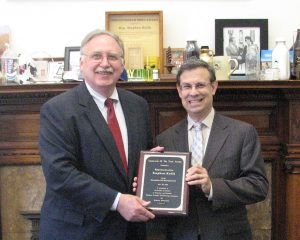 Representative Stephen Kulik, who could not be present at the MAPC Annual Meeting because the Legislature was in session, receiving the MAPC 2014 Legislator of the Year Award from MAPC Executive Director Marc Draisen on June 3, 2014, Boston, Mass. Staff photo.