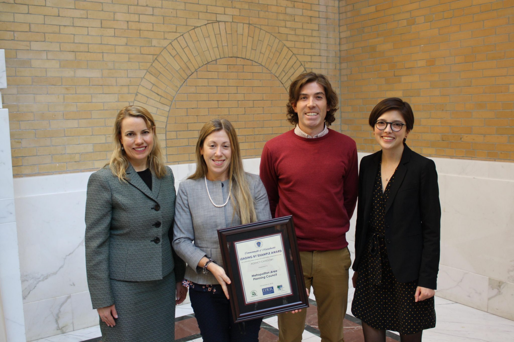 Leading by Example Award MAPC clean energy staff with Commissioner Judith Judson after being presented an award for outstanding clean energy achievements.