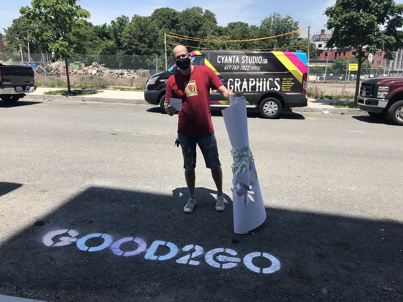 Good2Go Launch An artist stands above a stenciled "Good2Go" on the pavement.