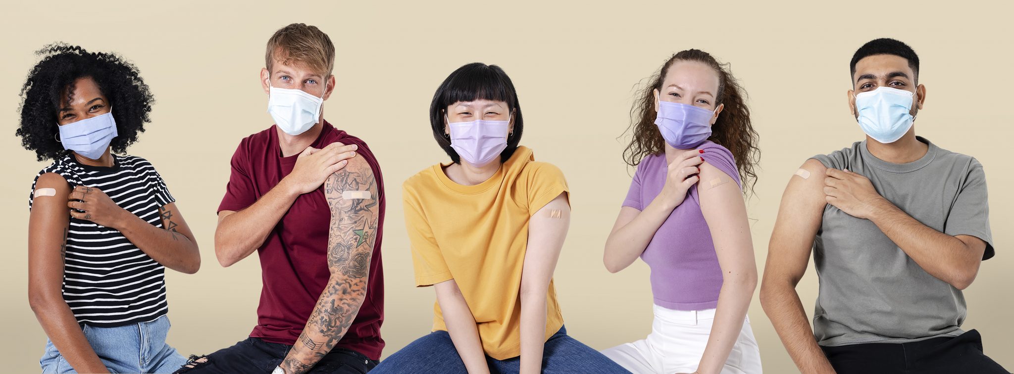 Vaccinated diverse people presenting shoulder Vaccinated diverse people presenting shoulder