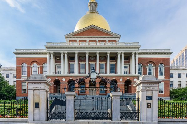 Image is a photo of the Massachusetts State house from the front.