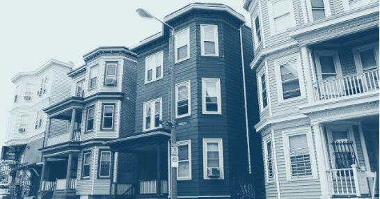 A photo of a row of four triple-decker houses. The image has a blue artistic tint.