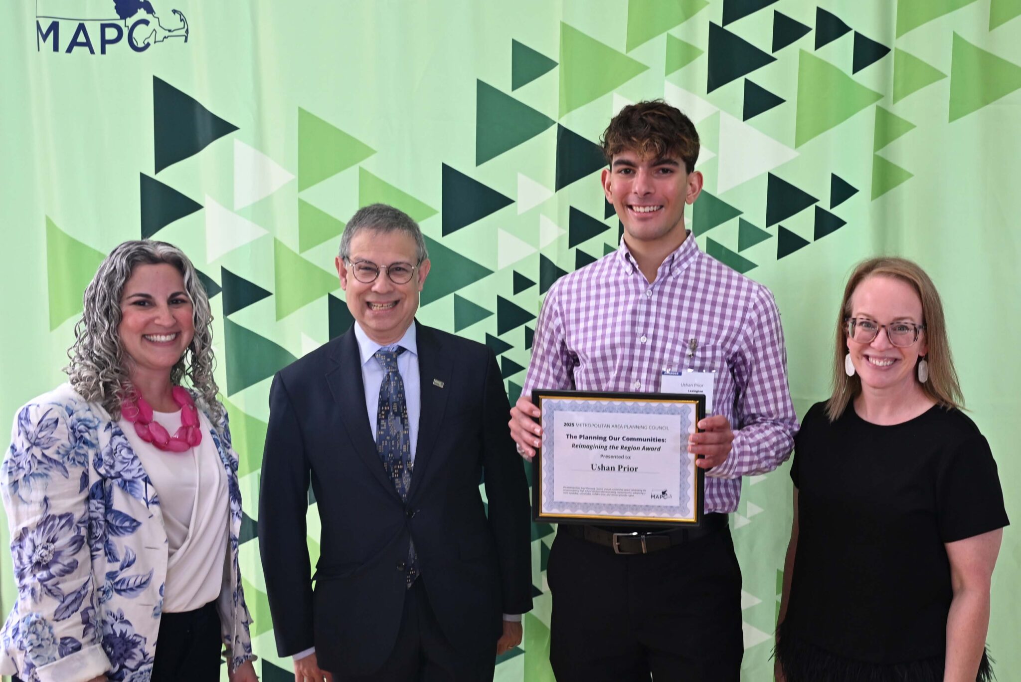 2025 Annual Council Meeting Left to right: MAPC Deputy Executive Director Lizzi Weyant, MAPC Executive Director Marc Draisen, Ushan Prior, high school student scholarship awardee, and MAPC Council President Erin Wortman, Town of Stoneham.