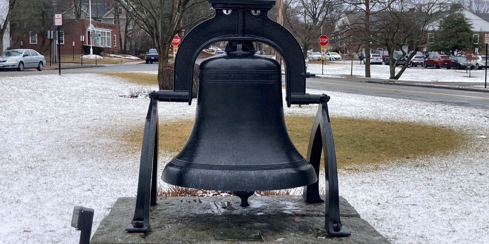 IMG_1245_resized Photo of the Taylor Vickers & Company bell, a large bell on a small platform in Lynnfield, Massachusetts. It's in the middle of a grassy area and there is a white coating of snow on the grass.